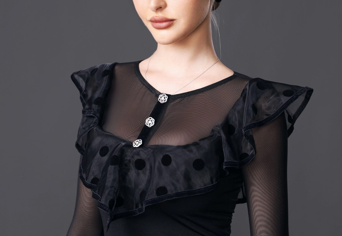 Black bodysuit top with illusion neckline and large ruffles with velvet polka dots