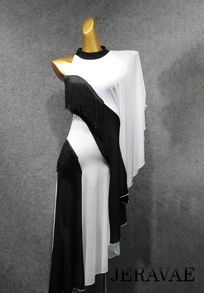 Mannequin holding Latin dress with two black stripes with fringe and two fringeless white stripes with a single white loose capelet sleeve and a short black collar