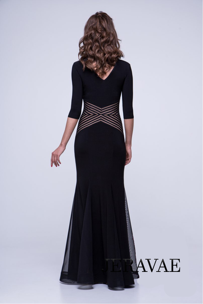 Back of model showing black ballroom dress with low V back, Zig Zag detail at waist, mesh gussets from knee to end of dress, and 3/4 sleeves