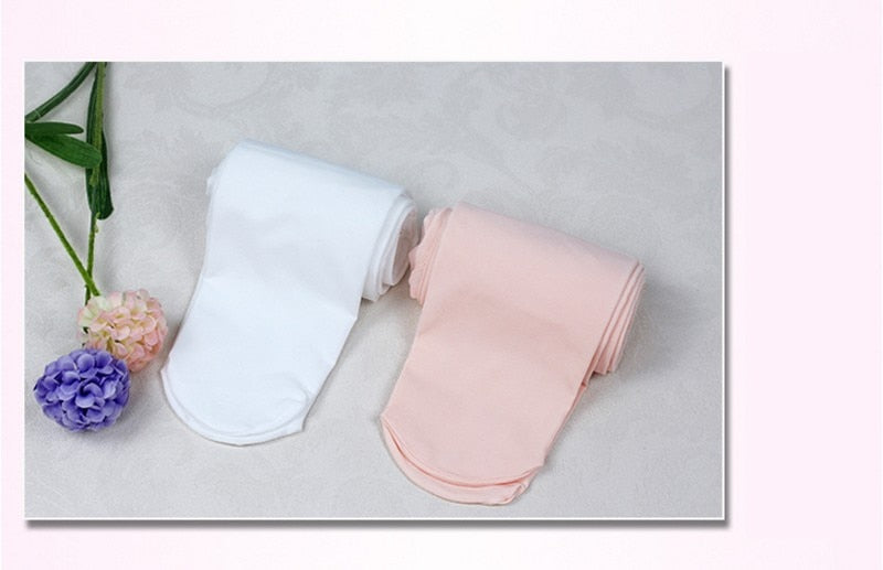 Rolled children's (boys or girls) tights in White or Nude Pink showing closed toe ends