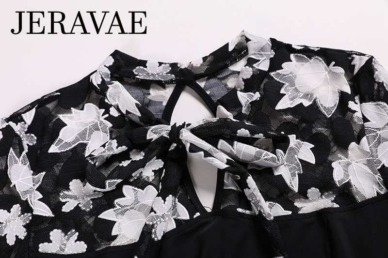 View of black and white floral mesh décolletage on dress